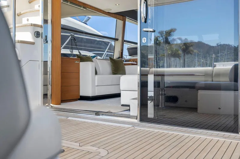 Slide: The Image of Luxurious interior of a 2015 Princess 60 Flybridge Motor Yacht with elegant seating and wood accents. - 14