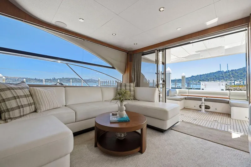 Slide: The Image of Luxurious interior of a 2015 Princess 60 Flybridge Motor Yacht with scenic marina view. - 18