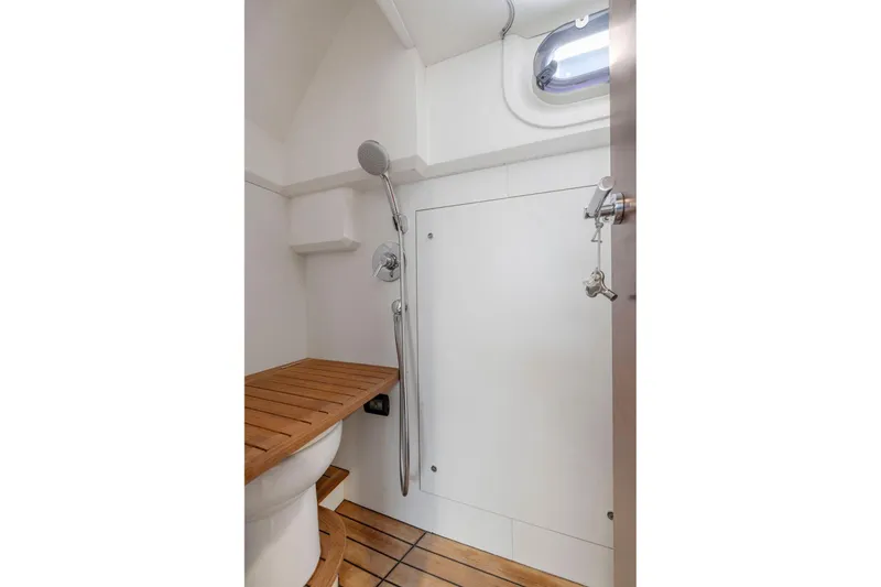 Slide: The Image of Bathroom interior of 2015 Princess 60 Flybridge Motor Yacht with wooden accents and shower. - 51