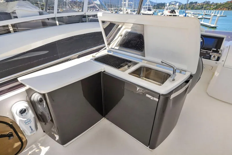 Slide: The Image of Outdoor kitchenette on 2015 Princess 60 Flybridge Motor Yacht with sink and grill. - 55