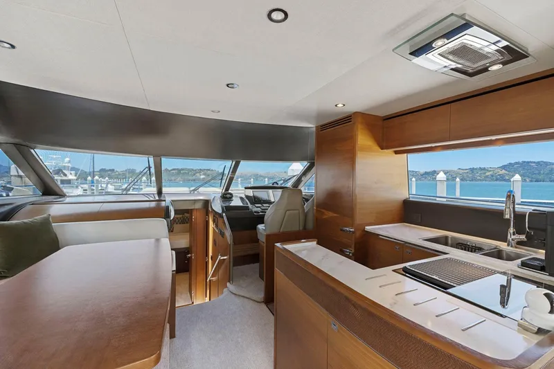 Slide: The Image of Luxurious interior of 2015 Princess 60 Flybridge Motor Yacht with modern kitchen and scenic views. - 25