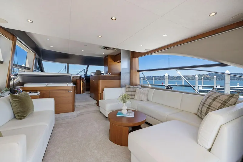 Slide: The Image of Luxurious interior of 2015 Princess 60 Flybridge Motor Yacht with elegant seating and scenic views. - 17