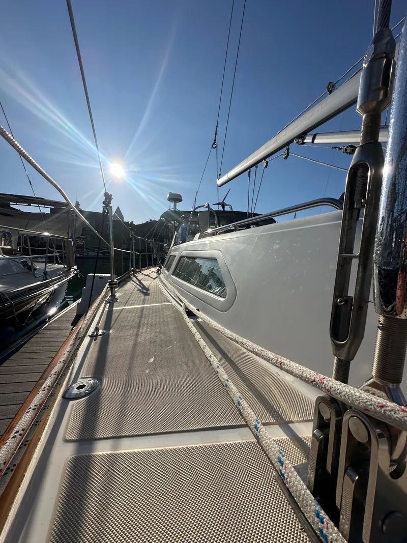 Slide: The Image of 2008 Outbound 46 sailboat deck under bright sun at marina. - 20