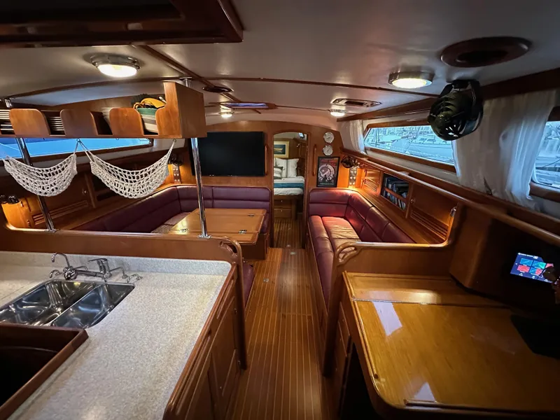 Slide: The Image of Luxurious interior of 2008 Outbound 46 yacht with wood finish and cozy seating. - 46