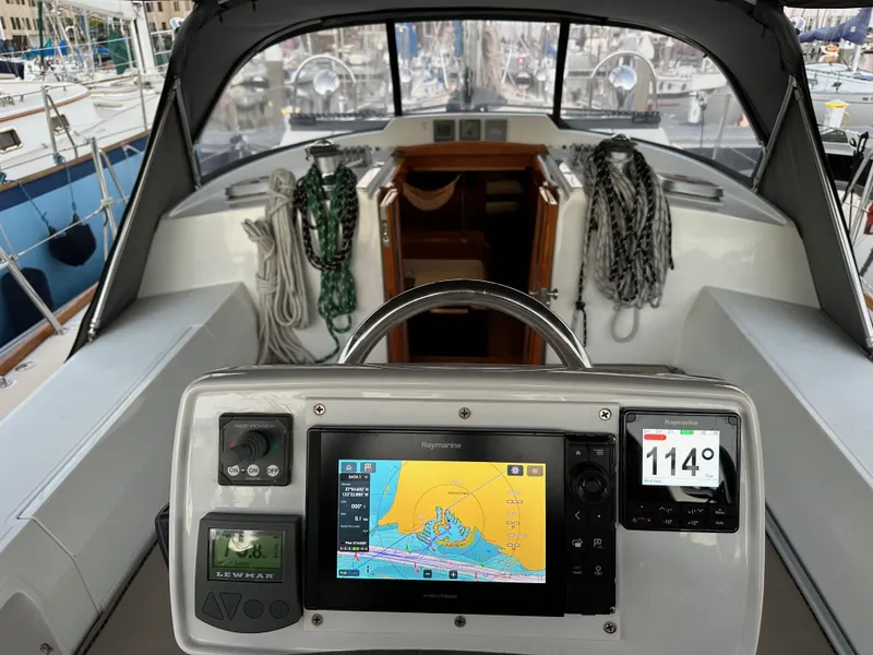 Slide: The Image of Cockpit of 2008 Outbound 46 sailboat with navigation equipment and ropes. - 25