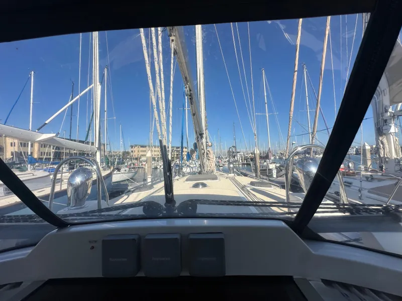 Slide: The Image of View from the cockpit of a 2008 Outbound 46 sailboat in a marina. - 22