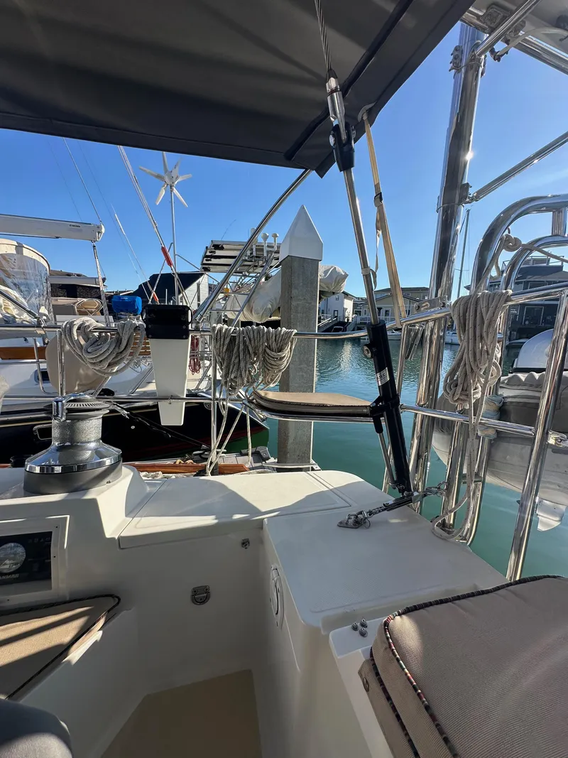 Slide: The Image of 2008 Outbound 46 yacht docked at marina, featuring sleek design and modern amenities. - 28