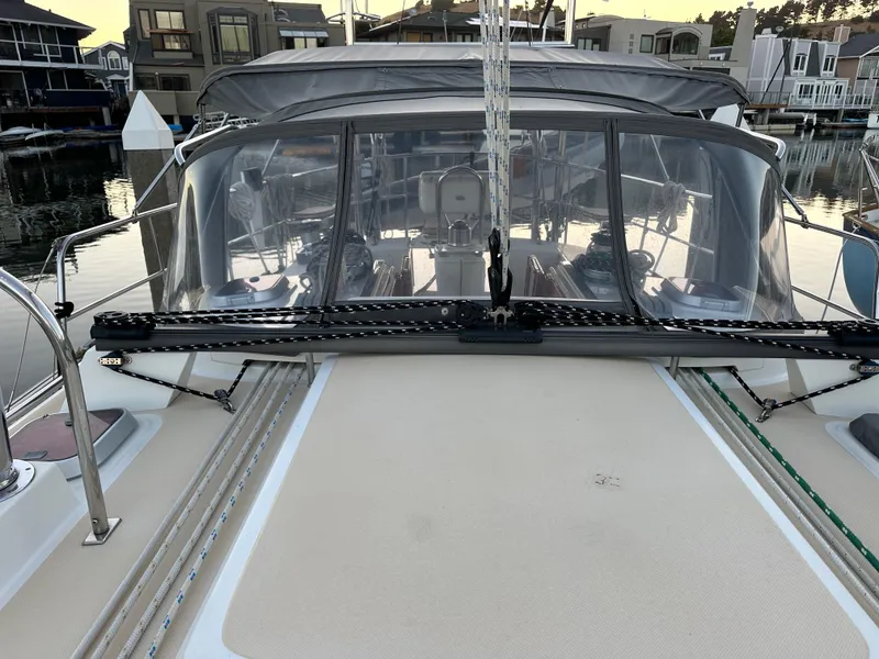 Slide: The Image of Outbound 46 sailboat from 2008, featuring a spacious cockpit and protective canopy in a marina setting. - 15