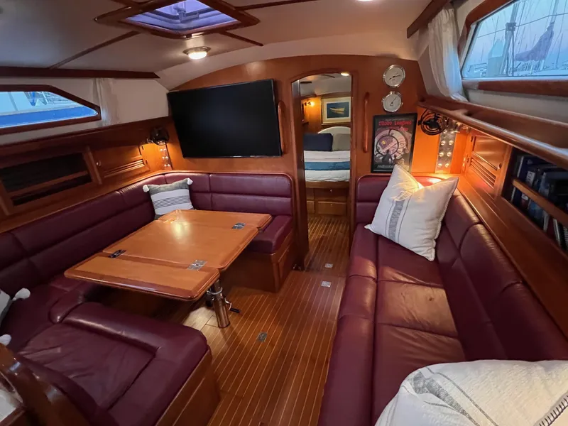Slide: The Image of Luxurious interior of 2008 Outbound 46 yacht with plush seating and wooden finishes. - 49