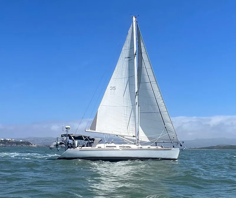 The Image of Sailing yacht Outbound 46, 2008 model, cruising on open water under clear blue skies. - 0
