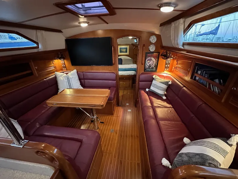 Slide: The Image of Luxurious 2008 Outbound 46 yacht interior with plush seating and elegant wood finishes. - 48