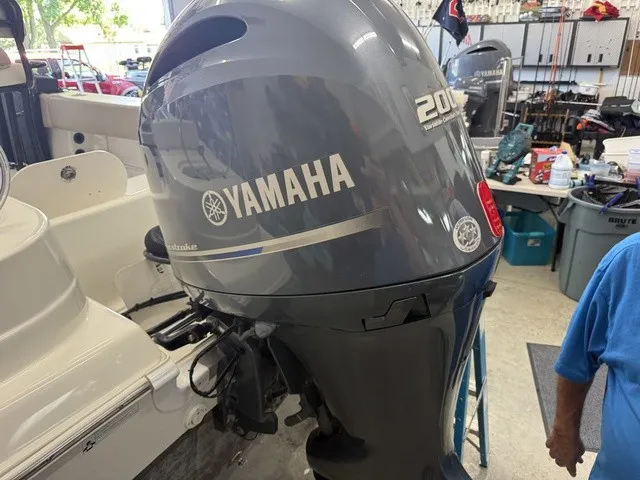 Slide: The Image of A Yamaha outboard motor is mounted on a 2016 NauticStar 2302 Legacy boat. - 15