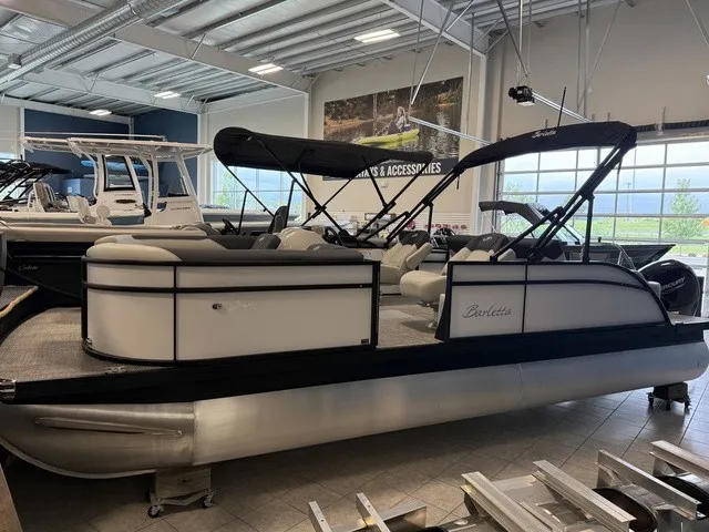 The Image of The image shows a Barletta Sanza 22 UC pontoon boat in a showroom. - 1