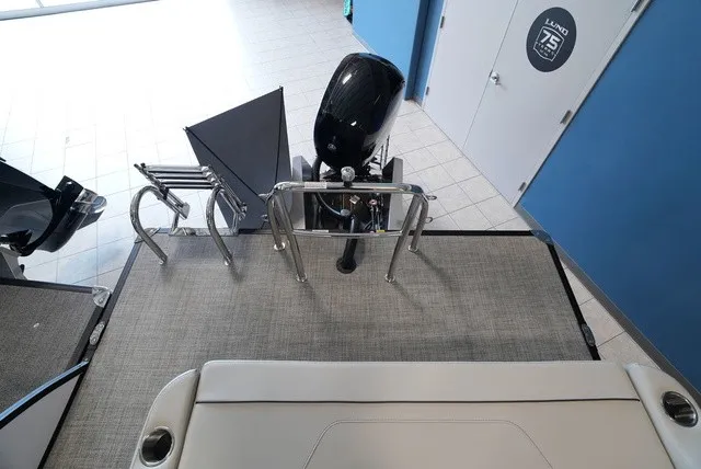 Slide: The Image of The image shows the rear of a Barletta Sanza 22 UC boat with an outboard motor. - 28