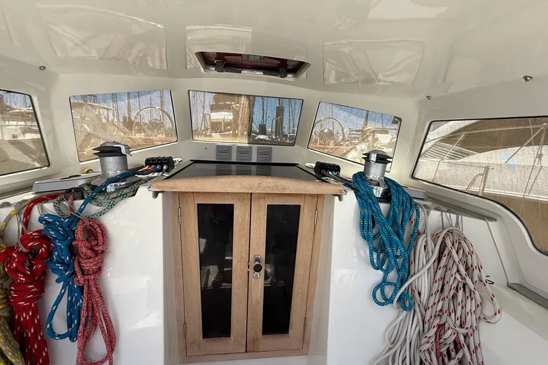 Slide: The Image of Cockpit  of 2011 Outbound 46 sailboat with ropes and winches. - 14