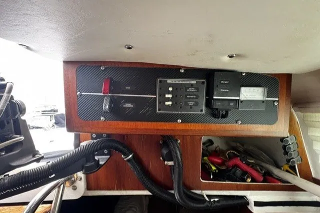 Slide: The Image of Control panel of a 1973 Custom BILL LEE 40 sailboat with wiring and switches. - 37
