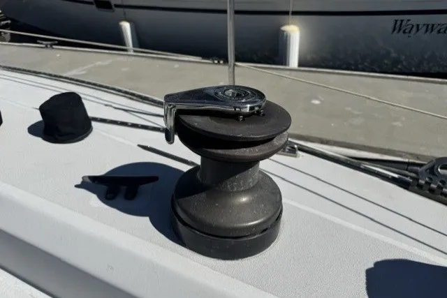 Slide: The Image of Winch on deck of 1973 Custom BILL LEE 40 sailboat, with marina background. - 9