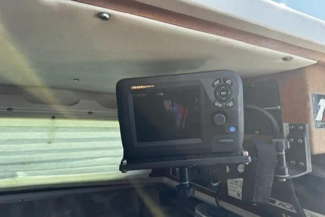 Slide: The Image of Fishfinder device mounted inside a 1973 Custom BILL LEE 40 boat cabin. - 19