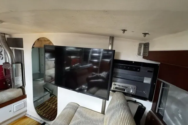 Slide: The Image of Interior of a 1973 Custom BILL LEE 40 yacht with modern TV and audio equipment. - 25