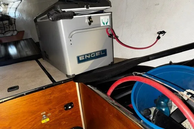 Slide: The Image of Interior of a 1973 Custom BILL LEE 40 yacht with Engel cooler and storage items. - 40