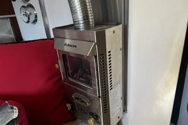 Slide: The Image of Compact marine heater inside a 1973 Custom BILL LEE 40 sailboat, featuring a Dickinson model. - 24