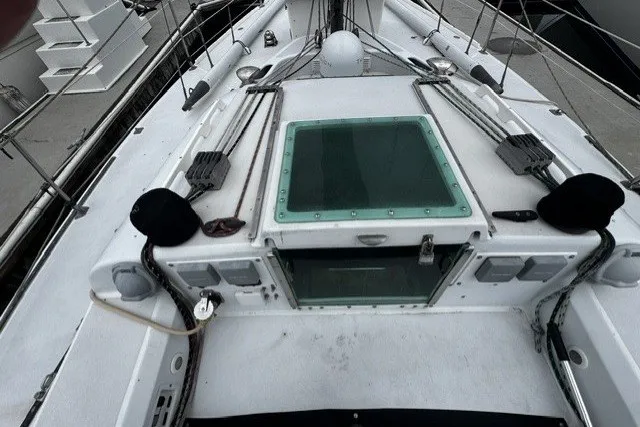 Slide: The Image of Deck view of a 1973 Custom BILL LEE 40 sailboat, featuring rigging and hatch. - 2