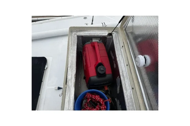 Slide: The Image of Storage compartment on 1973 Custom BILL LEE 40 sailboat with red Honda generator. - 43