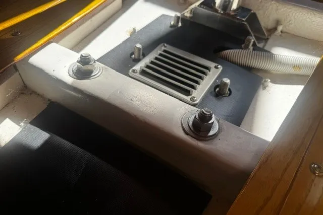 Slide: The Image of Engine compartment of a 1973 Custom BILL LEE 40 sailboat, featuring bolts and ventilation. - 39