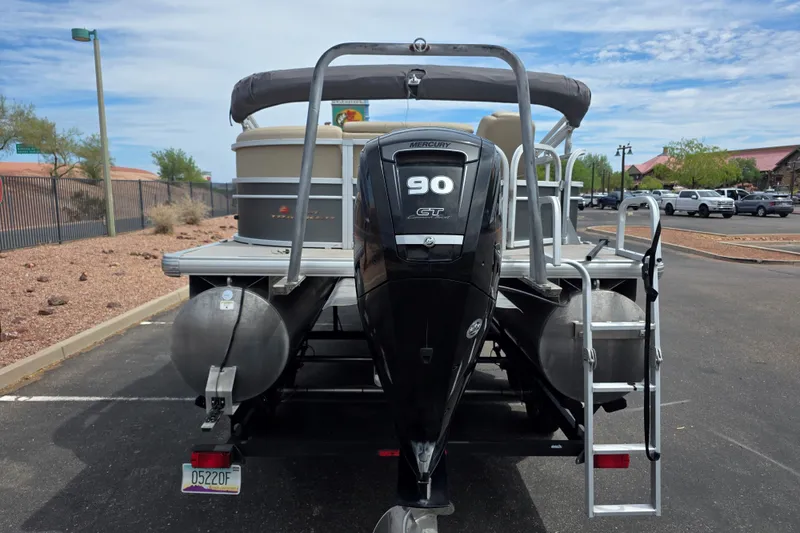Slide: The Image of 2019 Sun Tracker Party Barge 20 DLX with Mercury 90 HP engine in parking lot. - 14