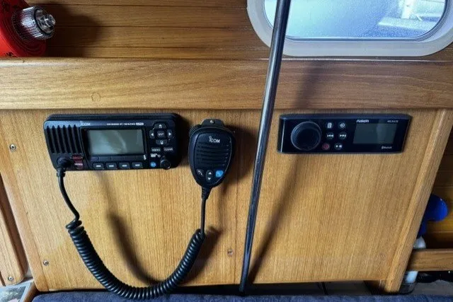 Slide: The Image of Control panel of a 2000 Catalina 320 sailboat with radio and navigation equipment. - 22