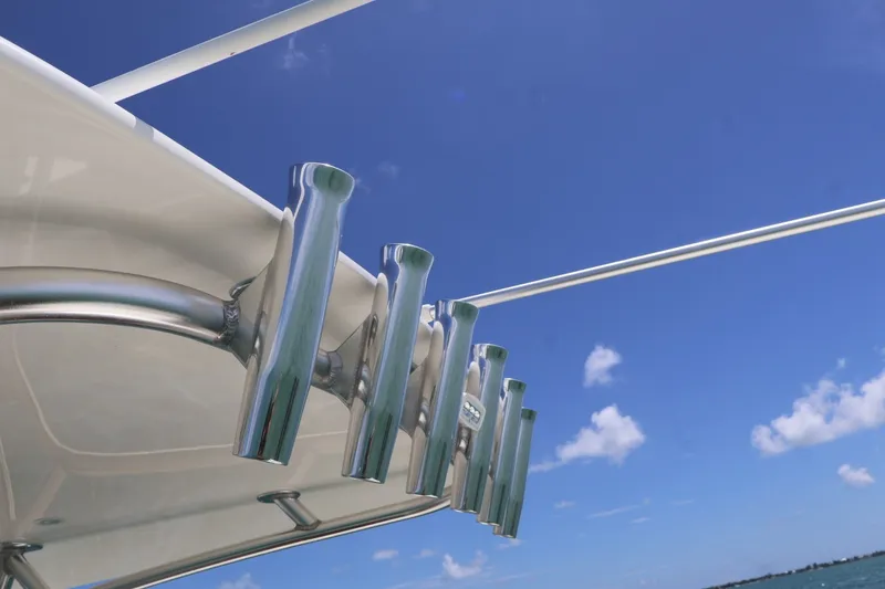 Slide: The Image of Rod holders on a 2021 SeaVee 322Z boat against a clear blue sky. - 20