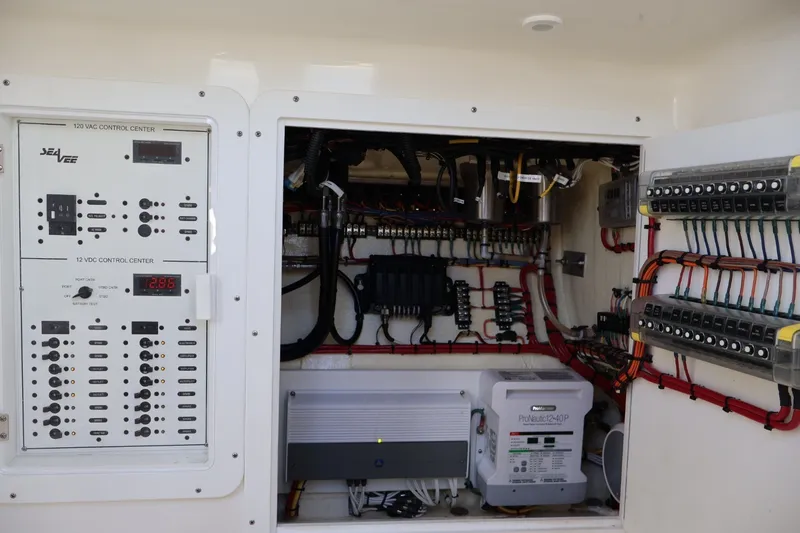 Slide: The Image of Electrical control panel of 2021 SeaVee 322Z boat, showcasing wiring and components. - 17