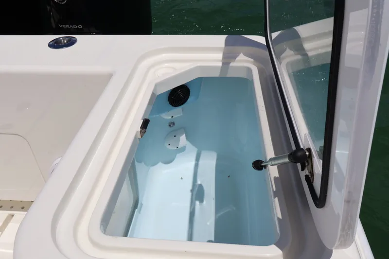 Slide: The Image of Open storage compartment on a 2021 SeaVee 322Z boat, featuring a clean interior. - 14