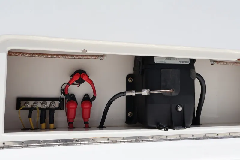Slide: The Image of 2021 SeaVee 322Z boat electrical compartment with wiring and battery setup. - 15