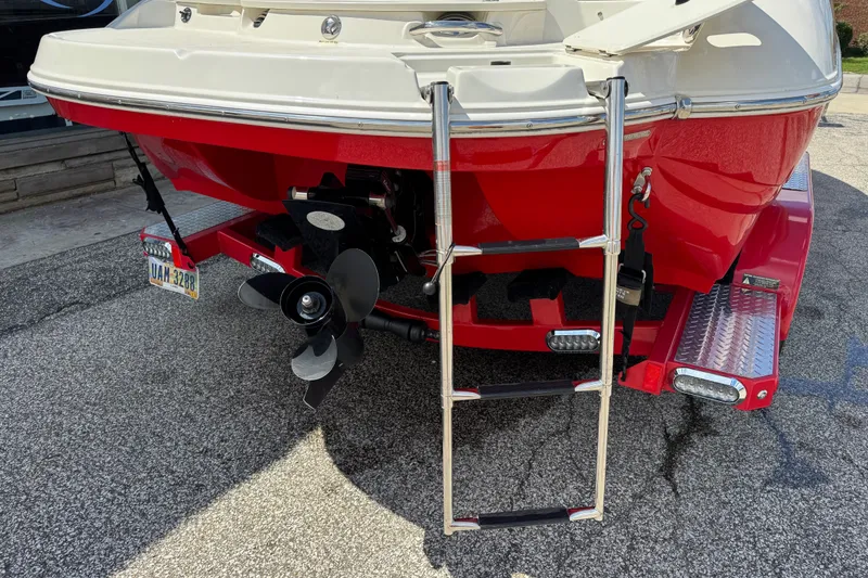 Slide: The Image of Rear view of a 2021 Stingray 208 LR boat with ladder and propeller. - 5