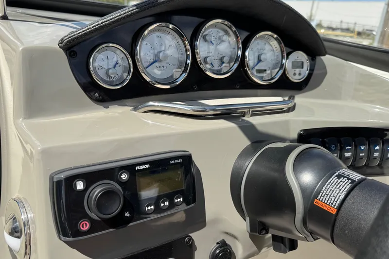 Slide: The Image of Dashboard of a 2021 Stingray 208 LR boat with gauges and controls. - 18