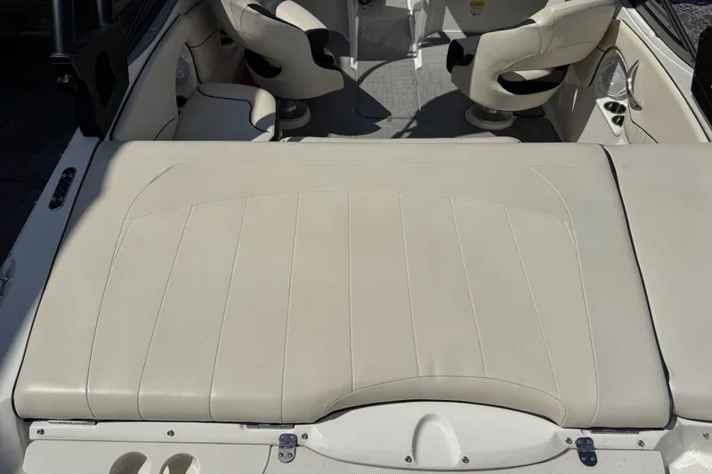 Slide: The Image of 2021 Stingray 208 LR boat interior with beige seating and modern design. - 22