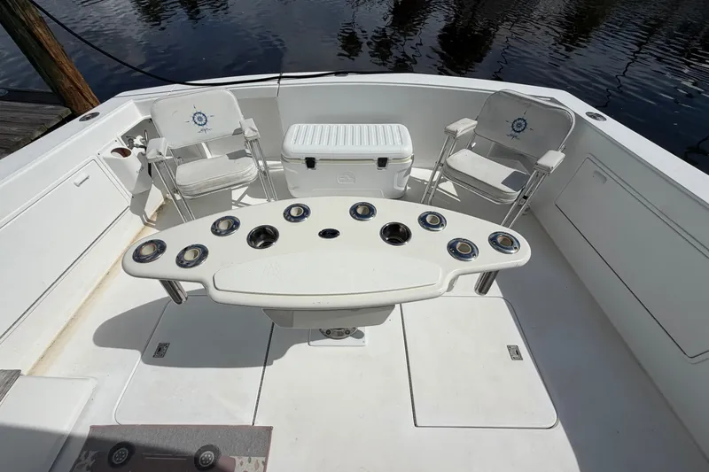 Slide: The Image of Cockpit of 1997 Fifth Ocean Yachts 40 with chairs and fishing rod holders. - 4