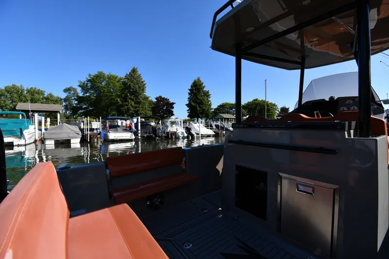 Slide: The Image of 2020 Dromeas D28 CC boat docked at a marina with clear blue skies. - 14