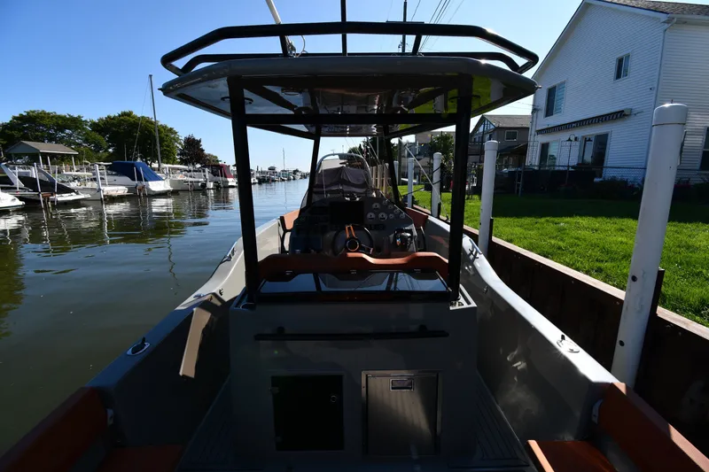 Slide: The Image of 2020 Dromeas D28 CC boat docked in a scenic marina setting. - 7