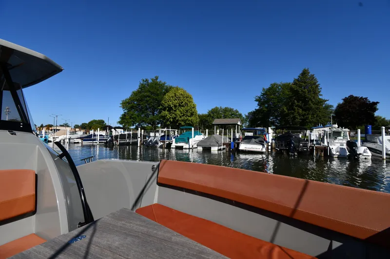 Slide: The Image of 2020 Dromeas D28 CC boat docked in a marina with clear blue sky. - 22