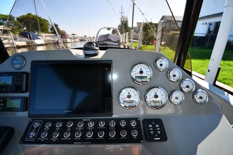 Slide: The Image of Control panel of a 2020 Dromeas D28 CC boat with gauges and navigation equipment. - 10