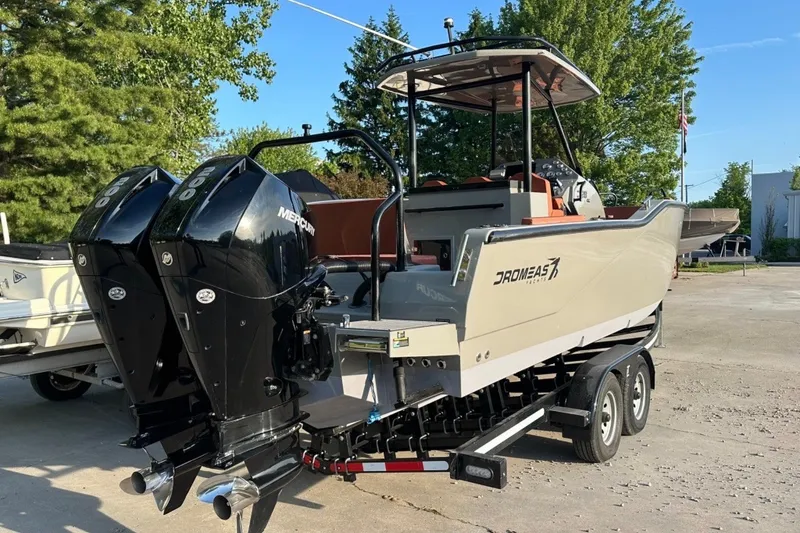 Slide: The Image of 2020 Dromeas D28 CC boat with dual Mercury engines on a trailer. - 2