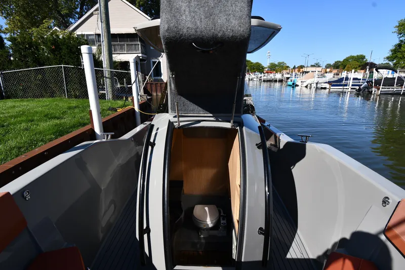 Slide: The Image of 2020 Dromeas D28 CC boat interior with open hatch and visible toilet. - 23