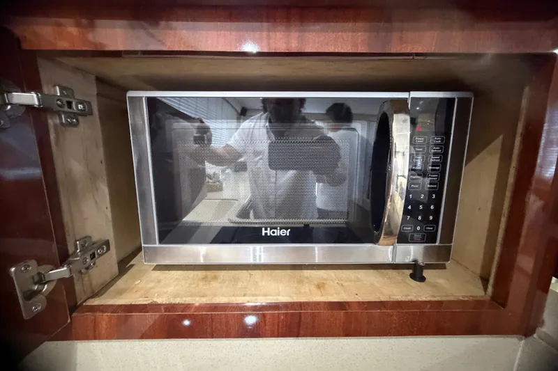 Slide: The Image of Haier microwave installed in a Phoenix 38 SFX Convertible yacht, 1999 model. - 41