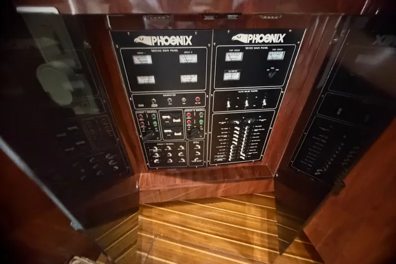Slide: The Image of Electrical control panel of a 1999 Phoenix 38 SFX Convertible boat. - 27