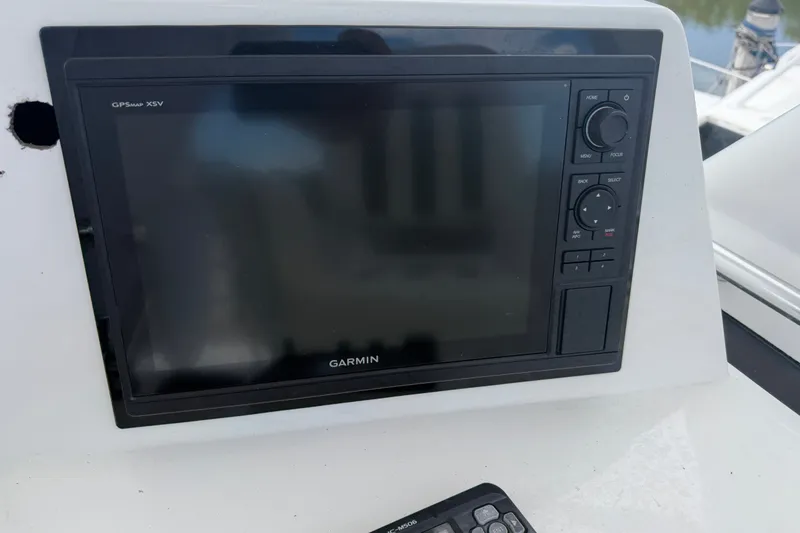Slide: The Image of Garmin GPSmap XSV on 1999 Phoenix 38 SFX Convertible boat dashboard. - 57