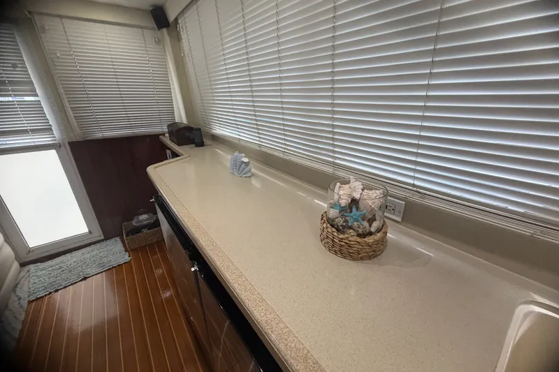 Slide: The Image of Interior of 1999 Phoenix 38 SFX Convertible with blinds and decorative seashells. - 38