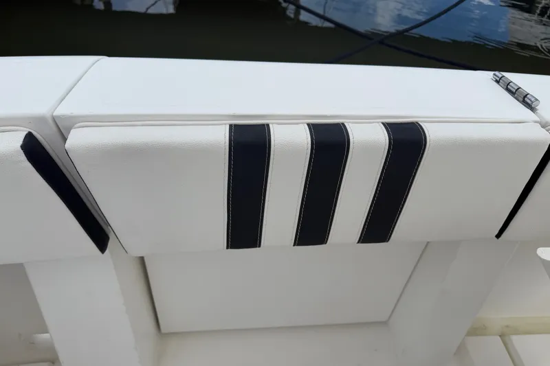 Slide: The Image of White and black cushioned seating on a 1999 Phoenix 38 SFX Convertible boat. - 15