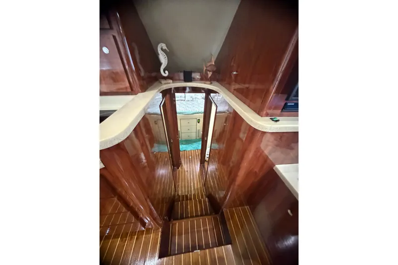 Slide: The Image of Interior of 1999 Phoenix 38 SFX Convertible yacht with polished wood and elegant design. - 39